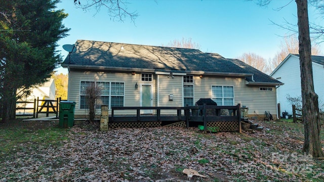 back of house featuring a deck