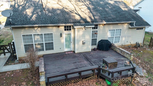 back of house featuring a wooden deck