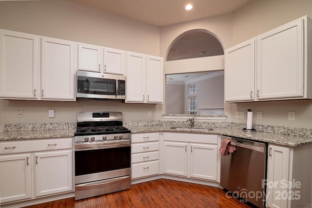 kitchen with sink, stainless steel appliances, and white cabinets