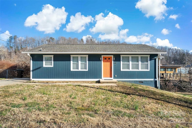 ranch-style home with a front yard