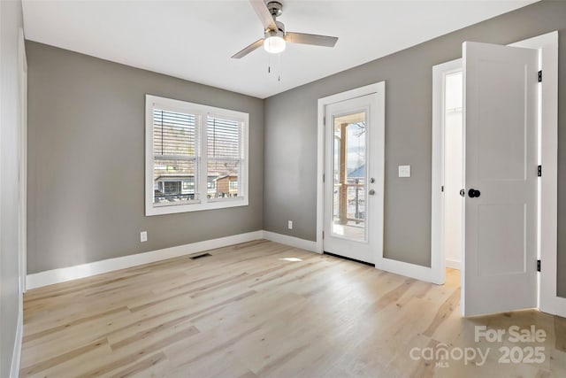 entryway with ceiling fan and light hardwood / wood-style flooring