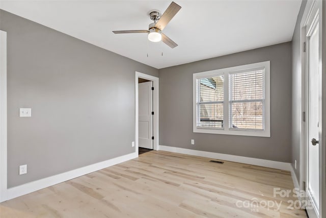 unfurnished bedroom with ceiling fan and light wood-type flooring