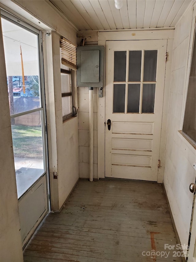 entryway with wood ceiling, wood-type flooring, and electric panel