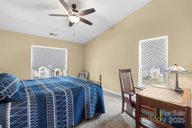 carpeted bedroom featuring vaulted ceiling and ceiling fan