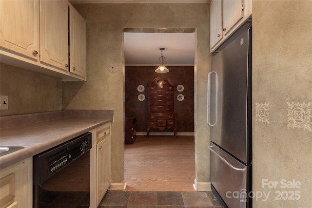 kitchen featuring crown molding, stainless steel refrigerator, dark hardwood / wood-style floors, dishwasher, and pendant lighting