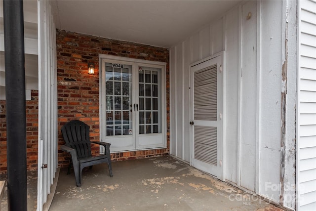 view of exterior entry featuring french doors