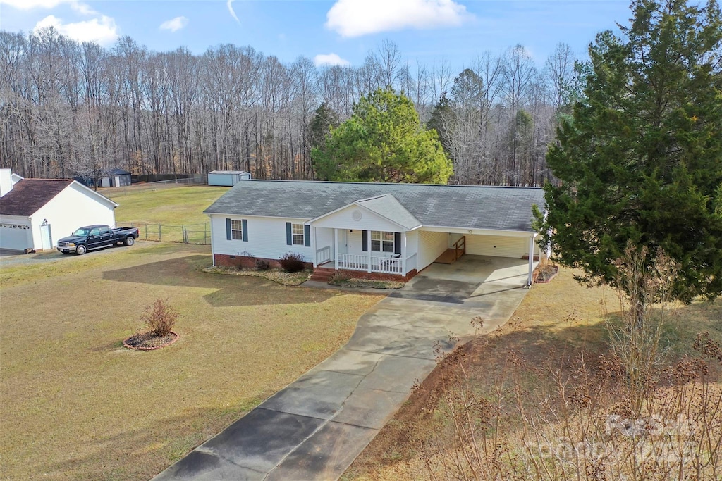 ranch-style home with a porch, a garage, and a front lawn