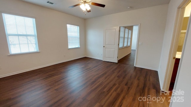 unfurnished bedroom featuring dark hardwood / wood-style floors and ceiling fan