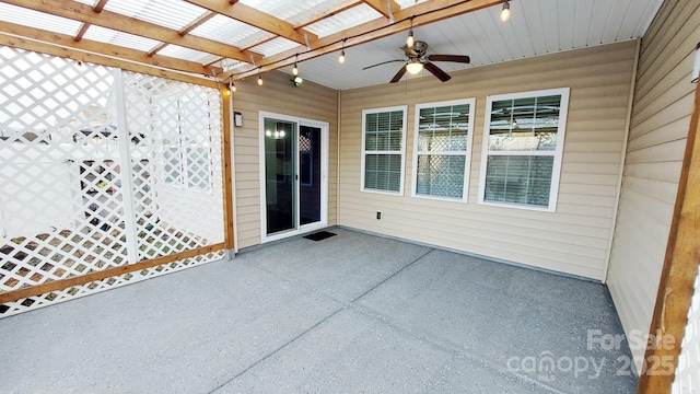 view of patio featuring ceiling fan and a pergola