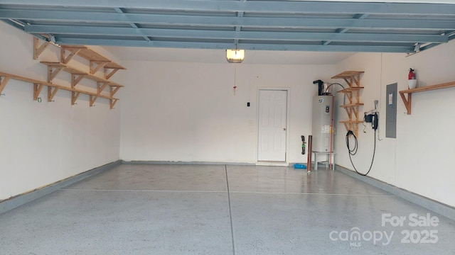 garage featuring a garage door opener, electric panel, and electric water heater