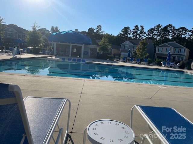 view of swimming pool featuring a patio area