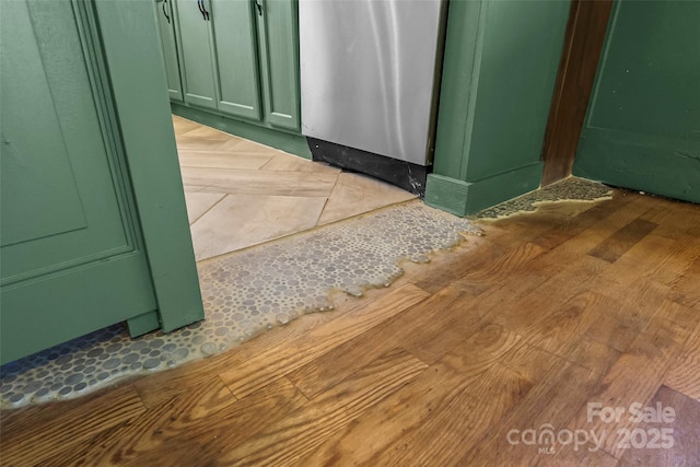 interior details with wood-type flooring and dishwashing machine