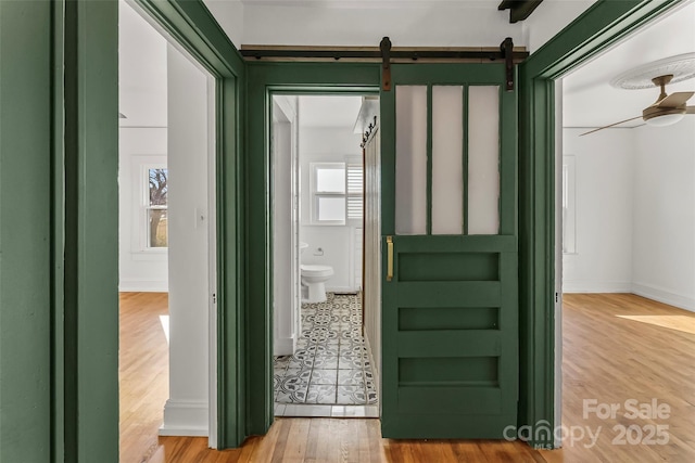 interior space with ceiling fan and hardwood / wood-style floors