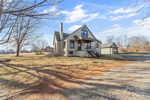 view of front of home featuring a garage and covered porch