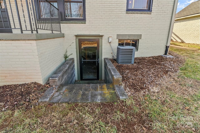 property entrance with central AC unit