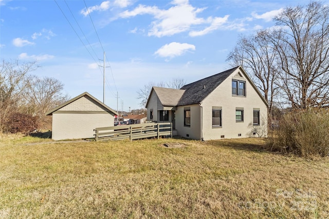 back of property with a lawn