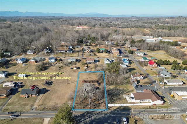 birds eye view of property featuring a mountain view