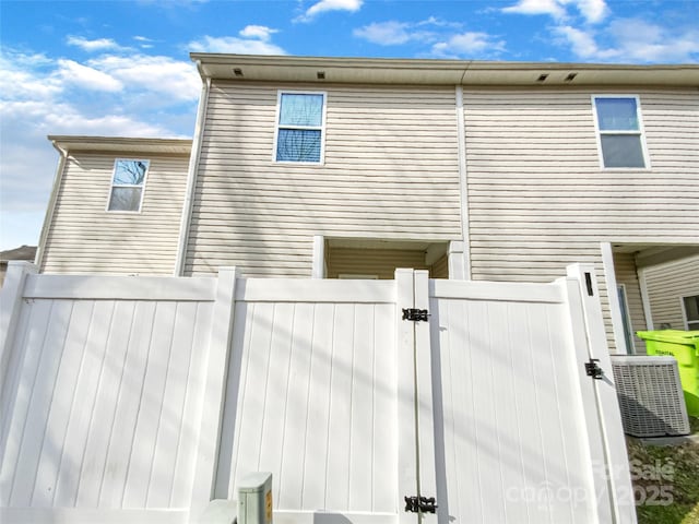 back of house featuring central AC