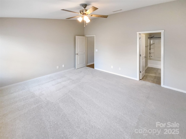 spare room featuring ceiling fan and light carpet