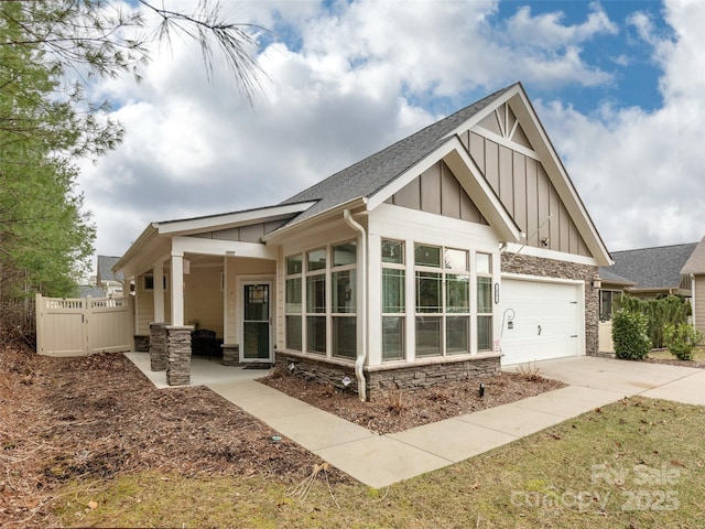 back of house with a garage