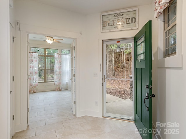 entrance foyer featuring ceiling fan