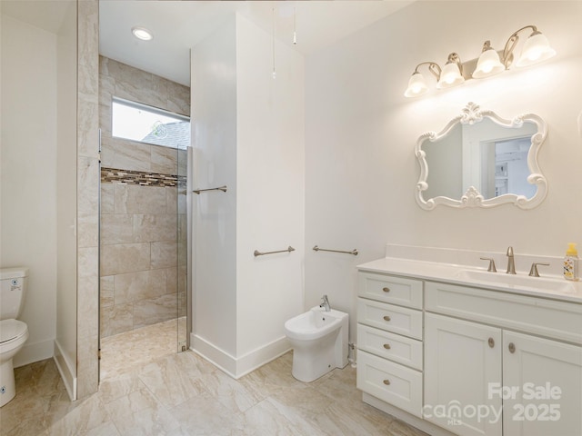 bathroom featuring tiled shower, vanity, toilet, and a bidet