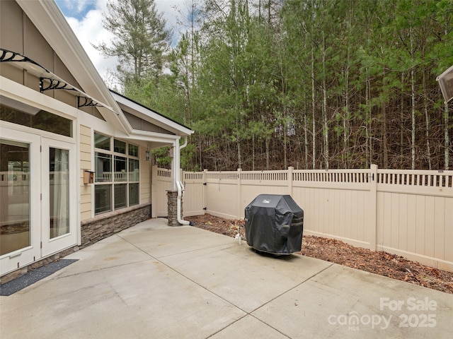 view of patio featuring a grill and french doors