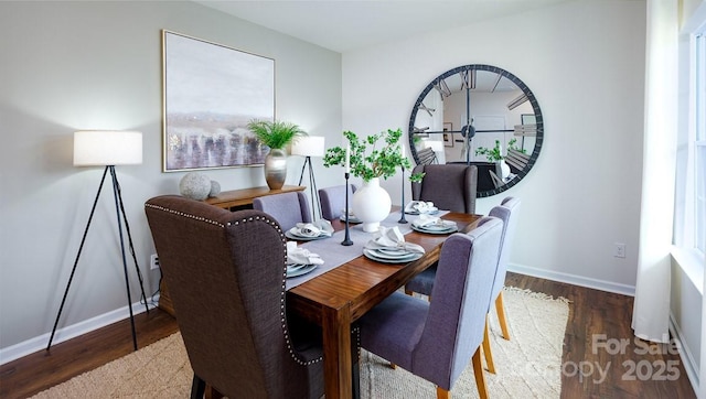 dining area with dark wood-type flooring