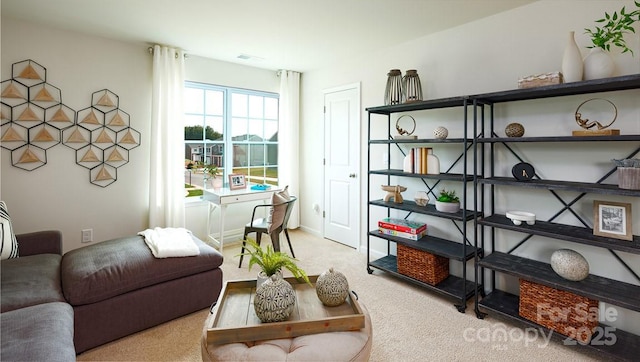 living area featuring light colored carpet