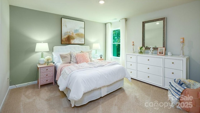 bedroom featuring light colored carpet