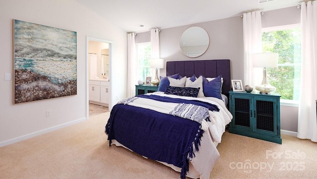 bedroom featuring light colored carpet, vaulted ceiling, and multiple windows