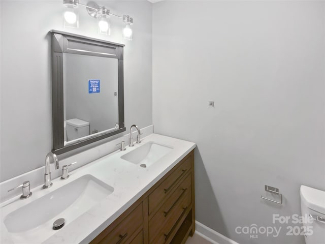 bathroom with vanity and toilet