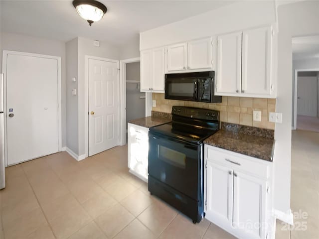 kitchen with dark stone countertops, white cabinets, backsplash, light tile patterned floors, and black appliances