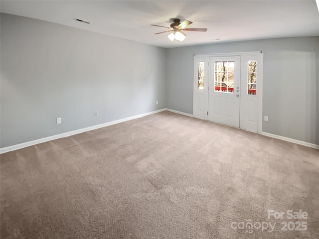 carpeted empty room with ceiling fan