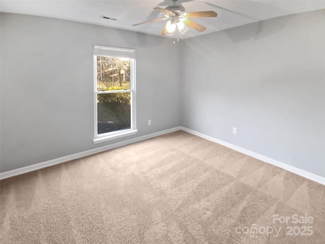 carpeted empty room with ceiling fan