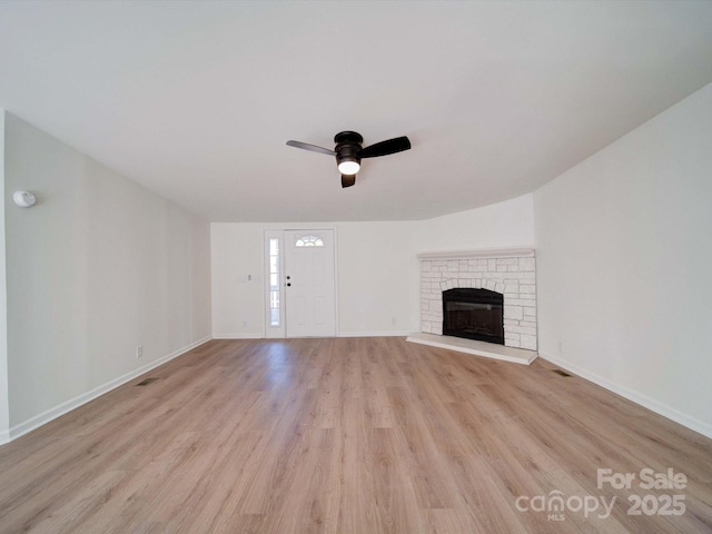 unfurnished living room with ceiling fan and light hardwood / wood-style flooring