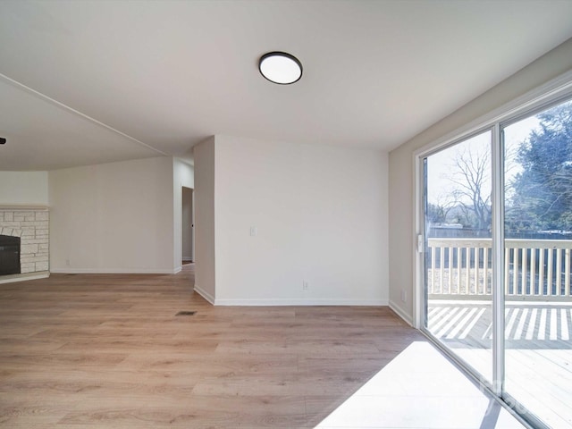 unfurnished living room featuring light wood-type flooring