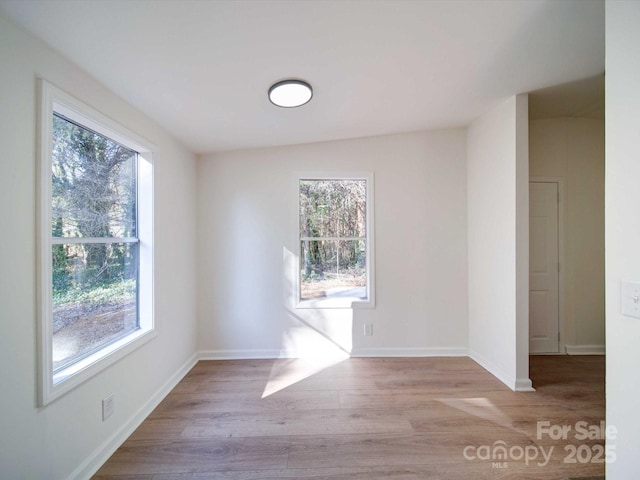 empty room with light hardwood / wood-style floors