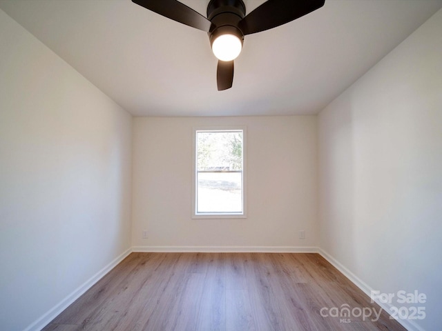 spare room featuring ceiling fan and light wood-type flooring