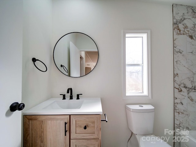 bathroom with vanity and toilet