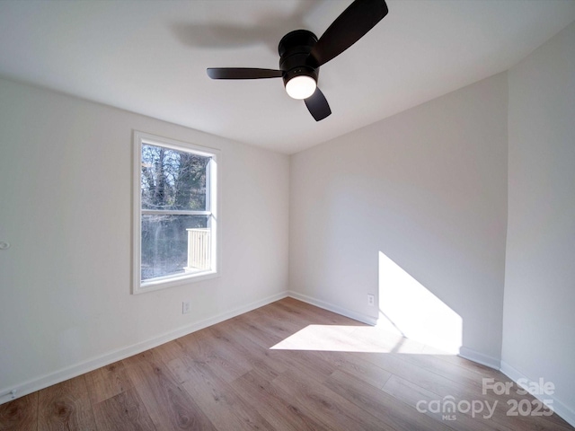 spare room featuring ceiling fan and light hardwood / wood-style floors