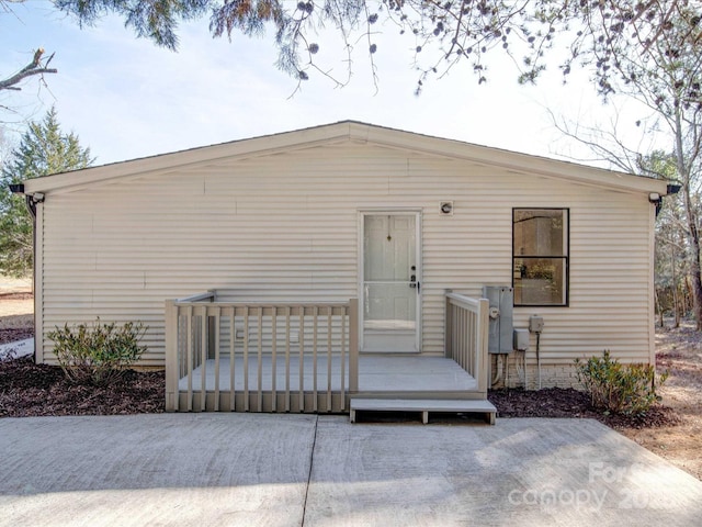 view of front facade with a wooden deck