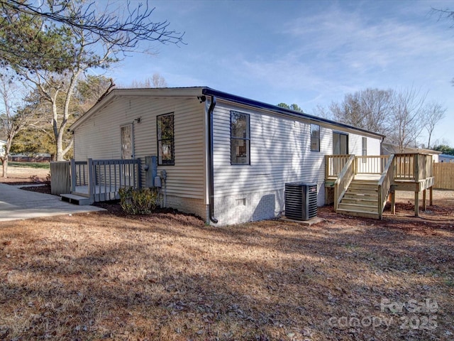 exterior space with a deck and central air condition unit