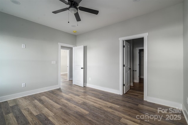 unfurnished bedroom with ceiling fan and dark hardwood / wood-style flooring