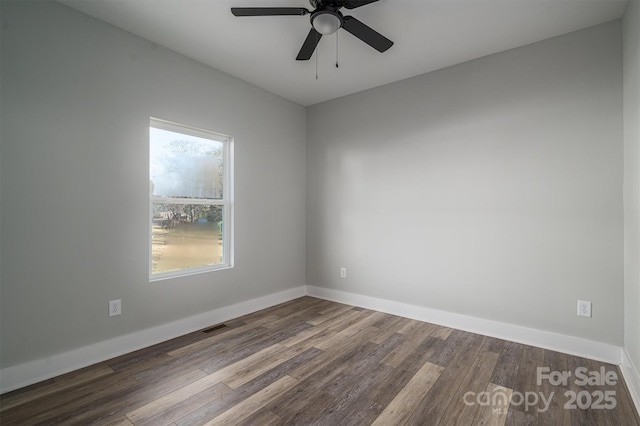 empty room with hardwood / wood-style floors and ceiling fan