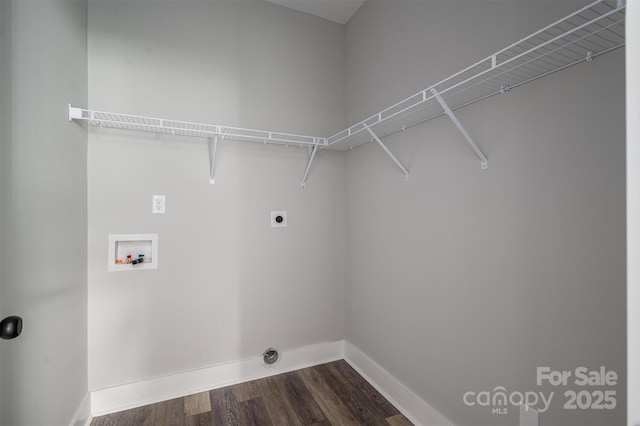 washroom featuring hookup for a washing machine, dark hardwood / wood-style floors, and hookup for an electric dryer