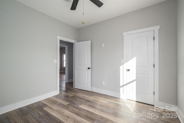 unfurnished room featuring ceiling fan and hardwood / wood-style floors