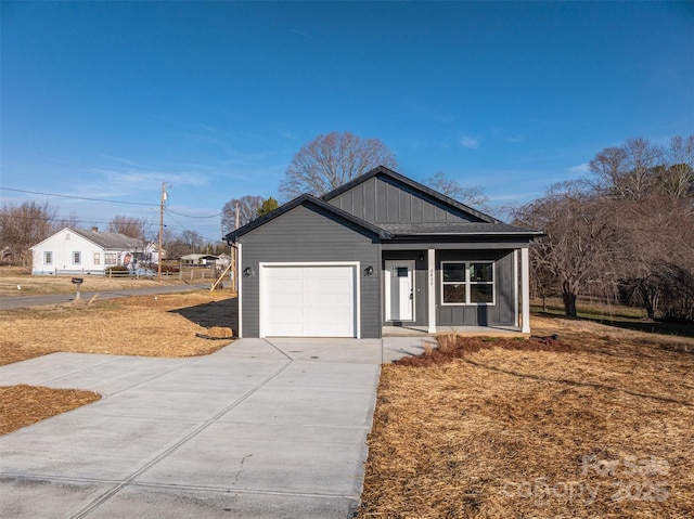 view of front of home featuring a porch and a garage