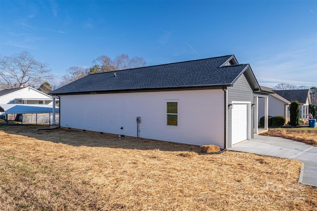 view of side of home with a yard