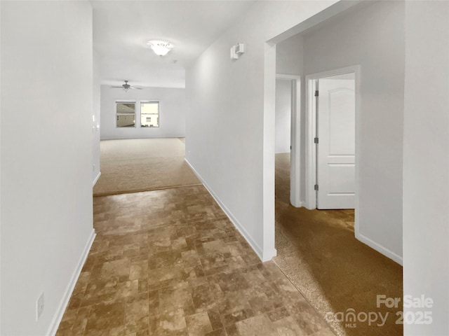 corridor with carpet flooring